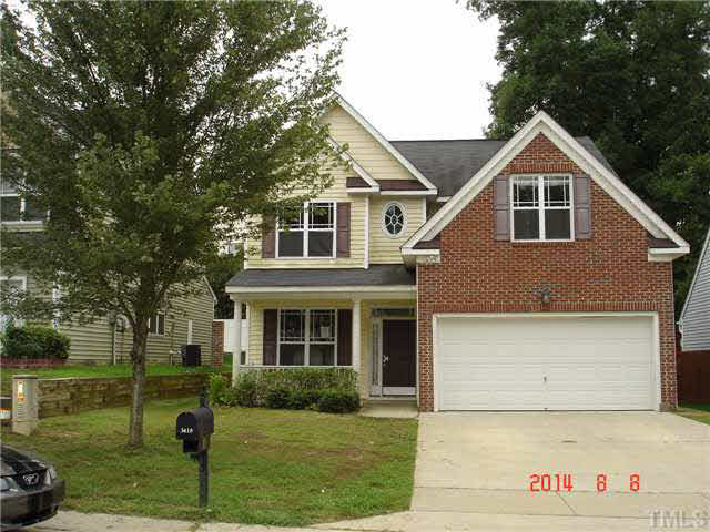 3418 Sunbright Lane Raleigh, NC 27610 - Photo 1 of 11 a front view of a house with a yard