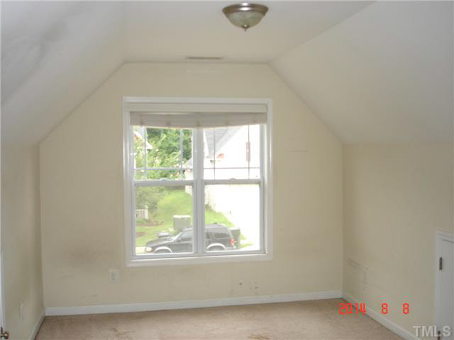 3418 Sunbright Lane Raleigh, NC 27610 - Photo 9 of 11 an empty room with a window