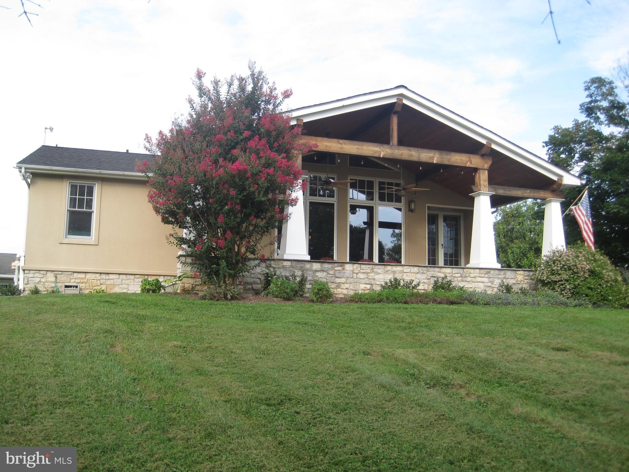 222 Stringtown Road Berryville, VA 22611 - Photo 4 of 29 a front view of a house with a yard