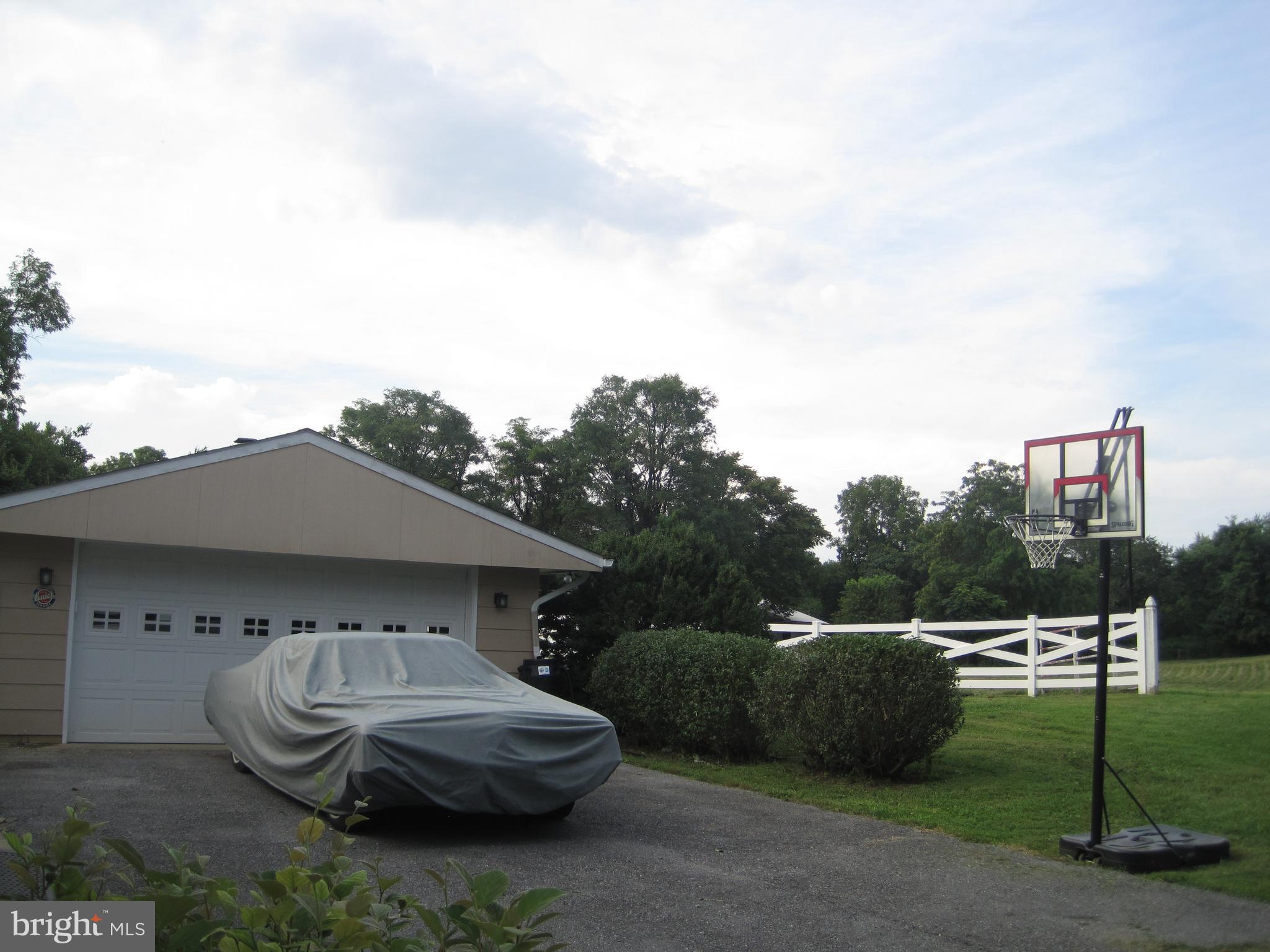 222 Stringtown Road Berryville, VA 22611 - Photo 6 of 29 a car parked in front of a house