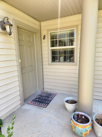 2525 West 450 South, Unit 8 Springville, UT 84663 - Photo 2 of 22 Entryway featuring a panel door, an exterior wall sconce, and a window with blinds