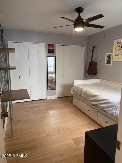 1246 East Palacio Lane Phoenix, AZ 85014 - Photo 11 of 17 a bedroom with a bed and a chandelier