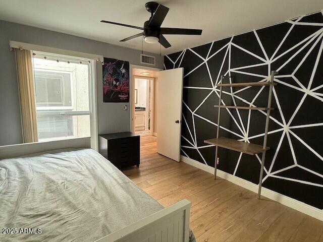 1246 East Palacio Lane Phoenix, AZ 85014 - Photo 12 of 17 a bedroom with a bed and a window