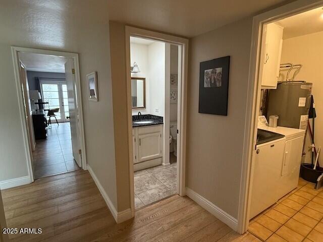1246 East Palacio Lane Phoenix, AZ 85014 - Photo 15 of 17 a view of a hallway with wooden floor and a bathroom