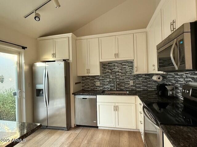1246 East Palacio Lane Phoenix, AZ 85014 - Photo 5 of 17 a kitchen with stainless steel appliances a refrigerator sink and microwave