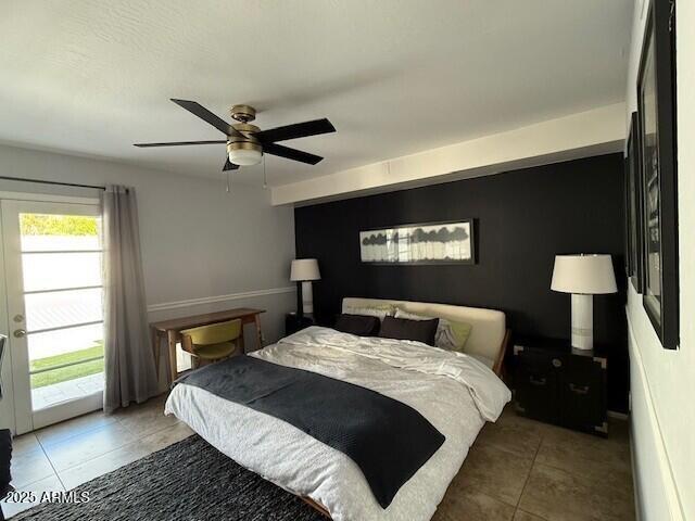 1246 East Palacio Lane Phoenix, AZ 85014 - Photo 8 of 17 a bedroom with a bed and a lamp