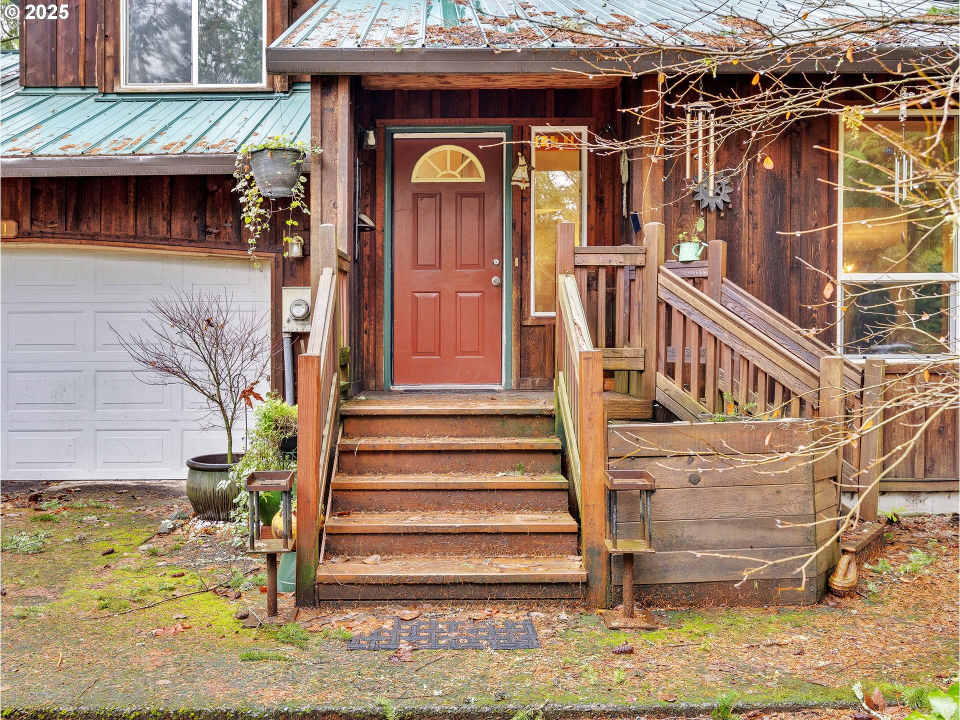64711 East Sandy River Lane Rhododendron, OR 97049 - Photo 3 of 47 a view of a house with a window and wooden fence