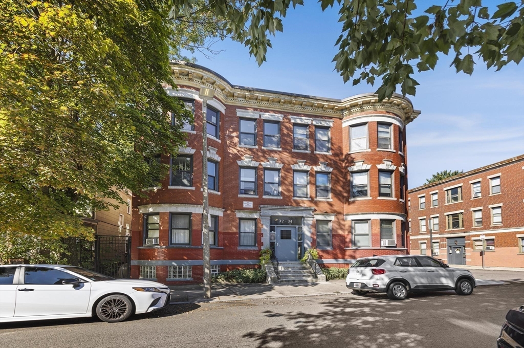 32-34 Ditson Street, Unit 6 Boston, MA 02122 - Photo 21 of 27 a car parked in front of a building