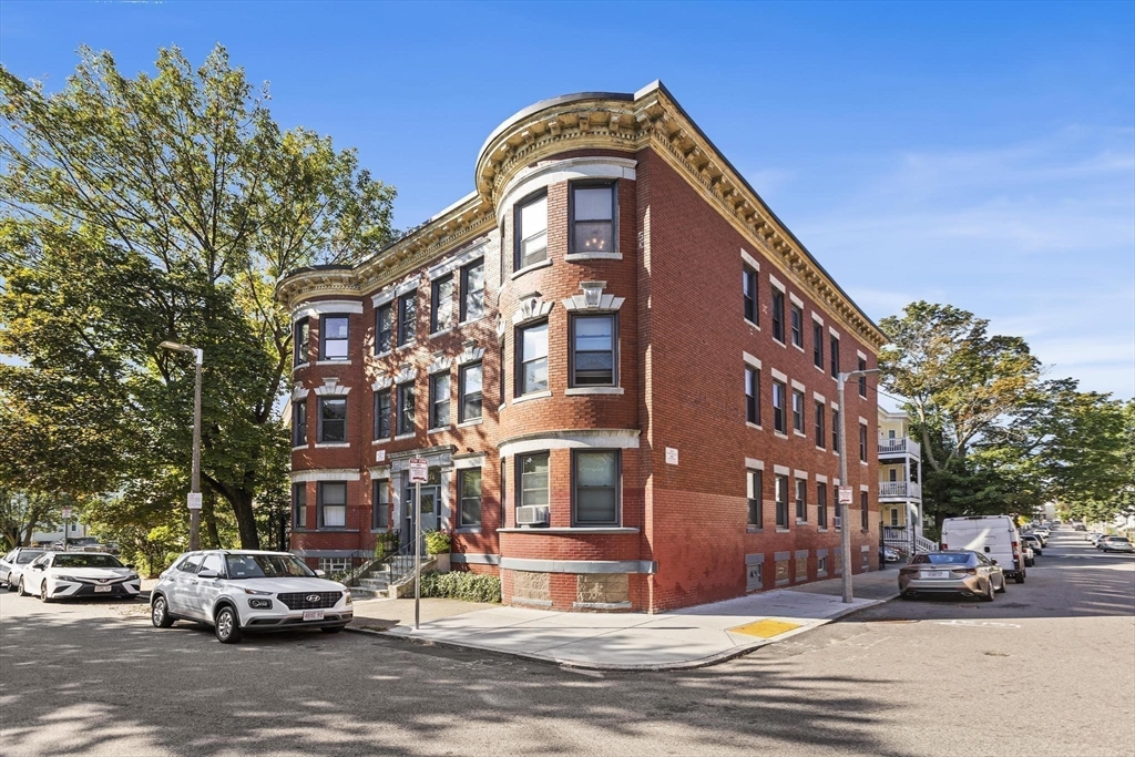 32-34 Ditson Street, Unit 6 Boston, MA 02122 - Photo 23 of 27 a front view of a building and car parked