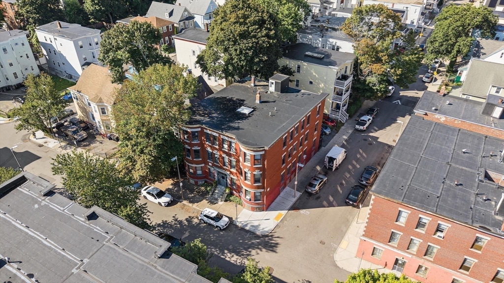 32-34 Ditson Street, Unit 6 Boston, MA 02122 - Photo 24 of 27 an aerial view of a house with a yard and garden