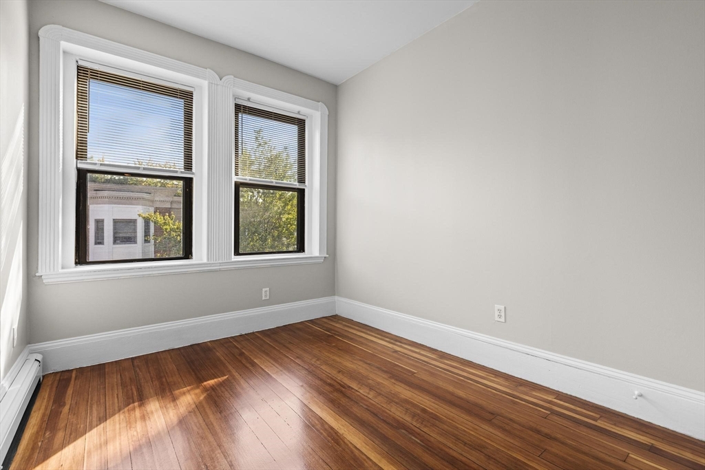 32-34 Ditson Street, Unit 6 Boston, MA 02122 - Photo 5 of 27 a view of empty room with window