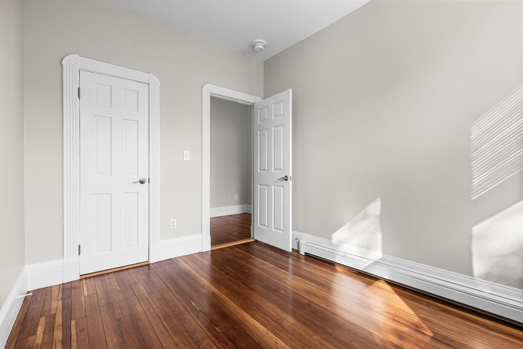 32-34 Ditson Street, Unit 6 Boston, MA 02122 - Photo 6 of 27 a view of empty room with wooden floor
