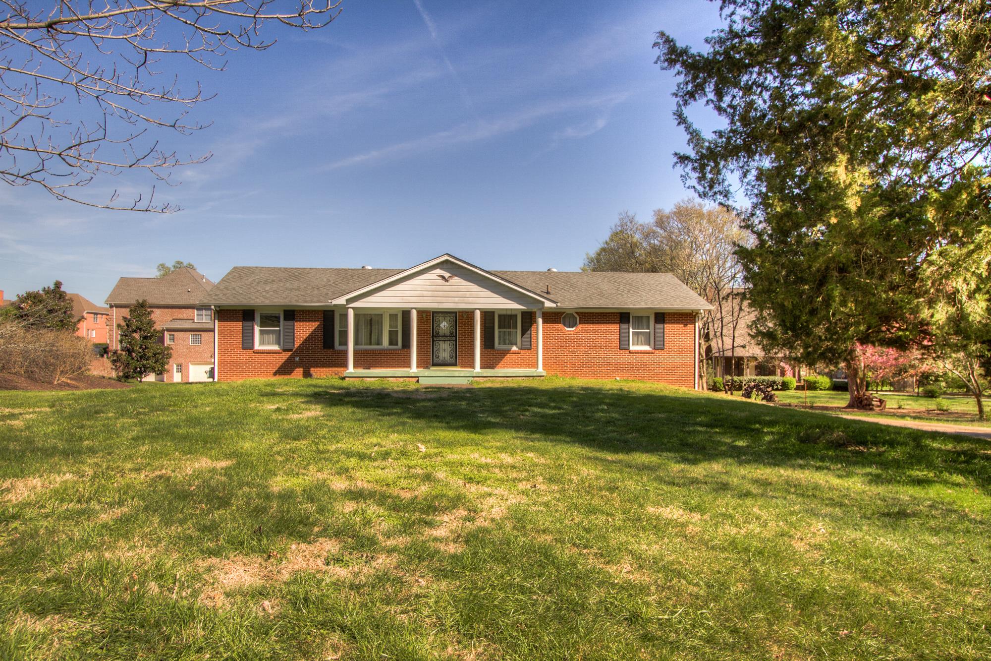472 Franklin Road Franklin, TN 37069 - Photo 3 of 20 a front of a house with a yard