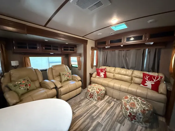 a living room with furniture and a glass door