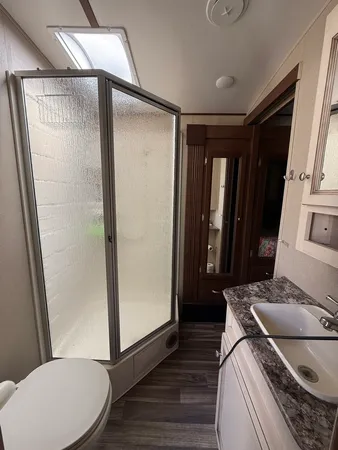 a bedroom with a bed and a mirror