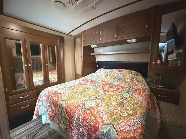 a bedroom with a bed and lamp with window