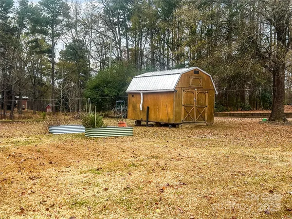 a view of a tiny house with a yard