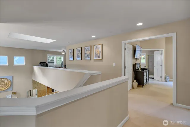 a view of a living room with furniture and a large window