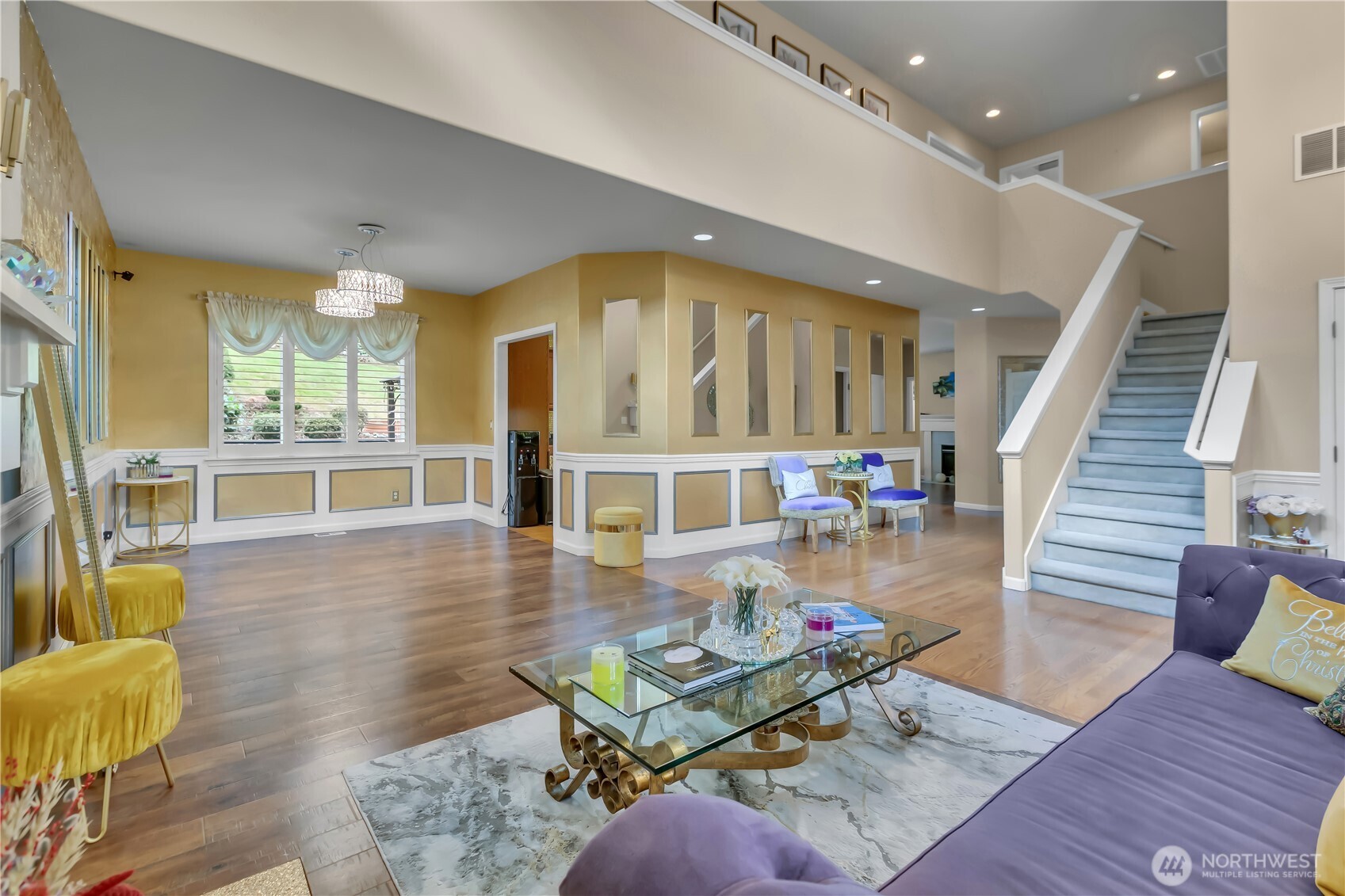 26525 Lake Fenwick Road South Kent, WA 98032 - Photo 5 of 40 a living room with furniture and a dining table with wooden floor