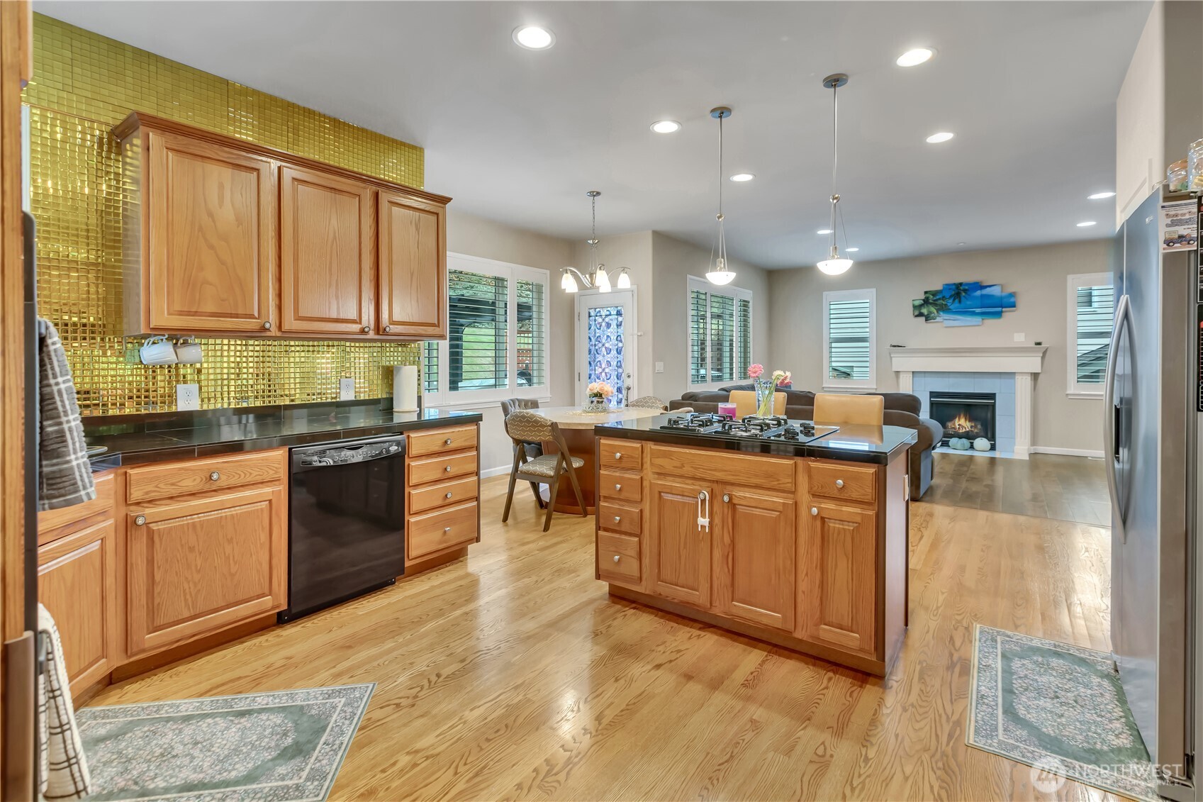 26525 Lake Fenwick Road South Kent, WA 98032 - Photo 10 of 40 a kitchen with stainless steel appliances granite countertop a stove a sink and a microwave