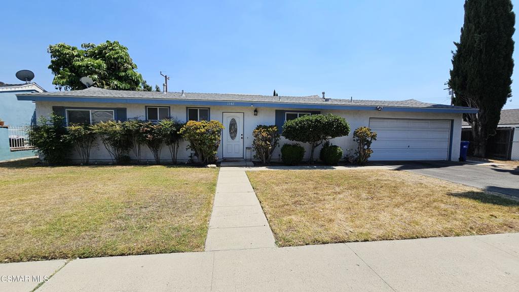 1542 Cochran Street Simi Valley, CA 93065 - Photo 2 of 5 a front view of a house with a yard