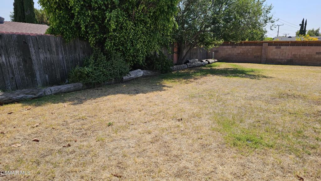 1542 Cochran Street Simi Valley, CA 93065 - Photo 5 of 5 a backyard of a house with lots of green space