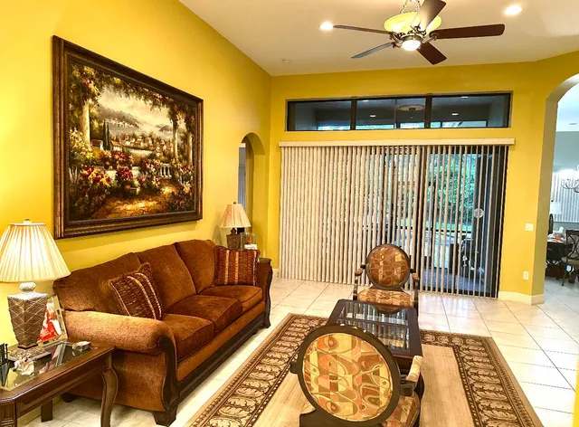 a living room with furniture and a large window