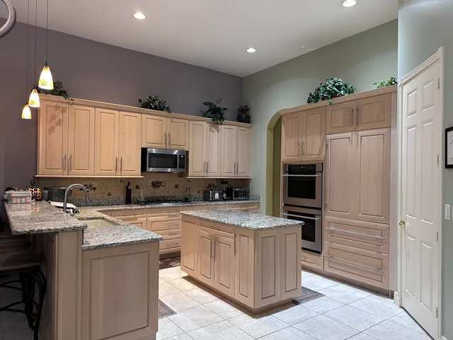 a kitchen with a sink stove and refrigerator