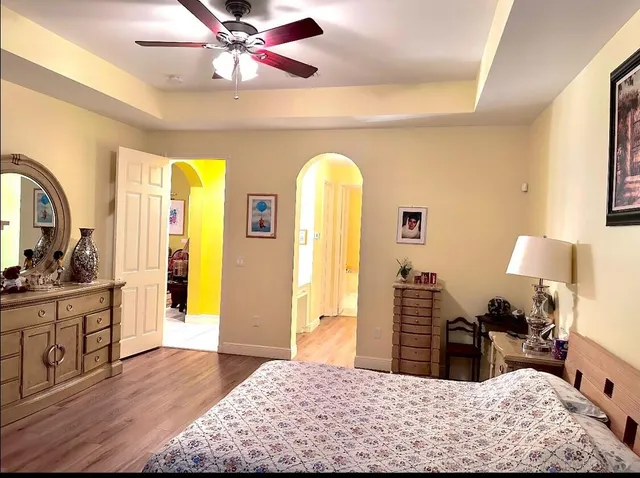 a bedroom with a bed and a dresser