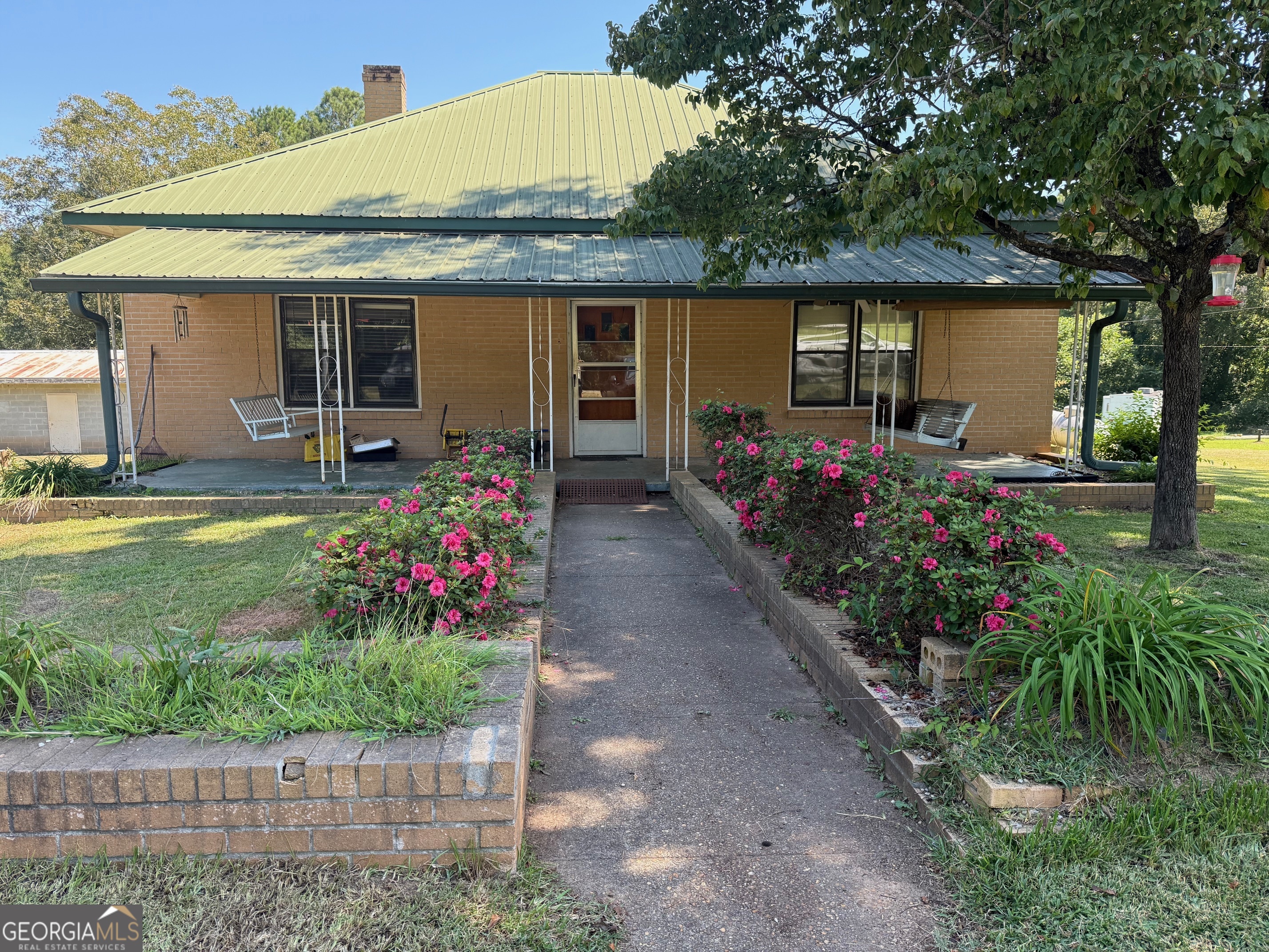 1600 Grant Avenue Manchester, GA 31816 - Photo 1 of 37 a front view of house with outdoor seating and entertaining space