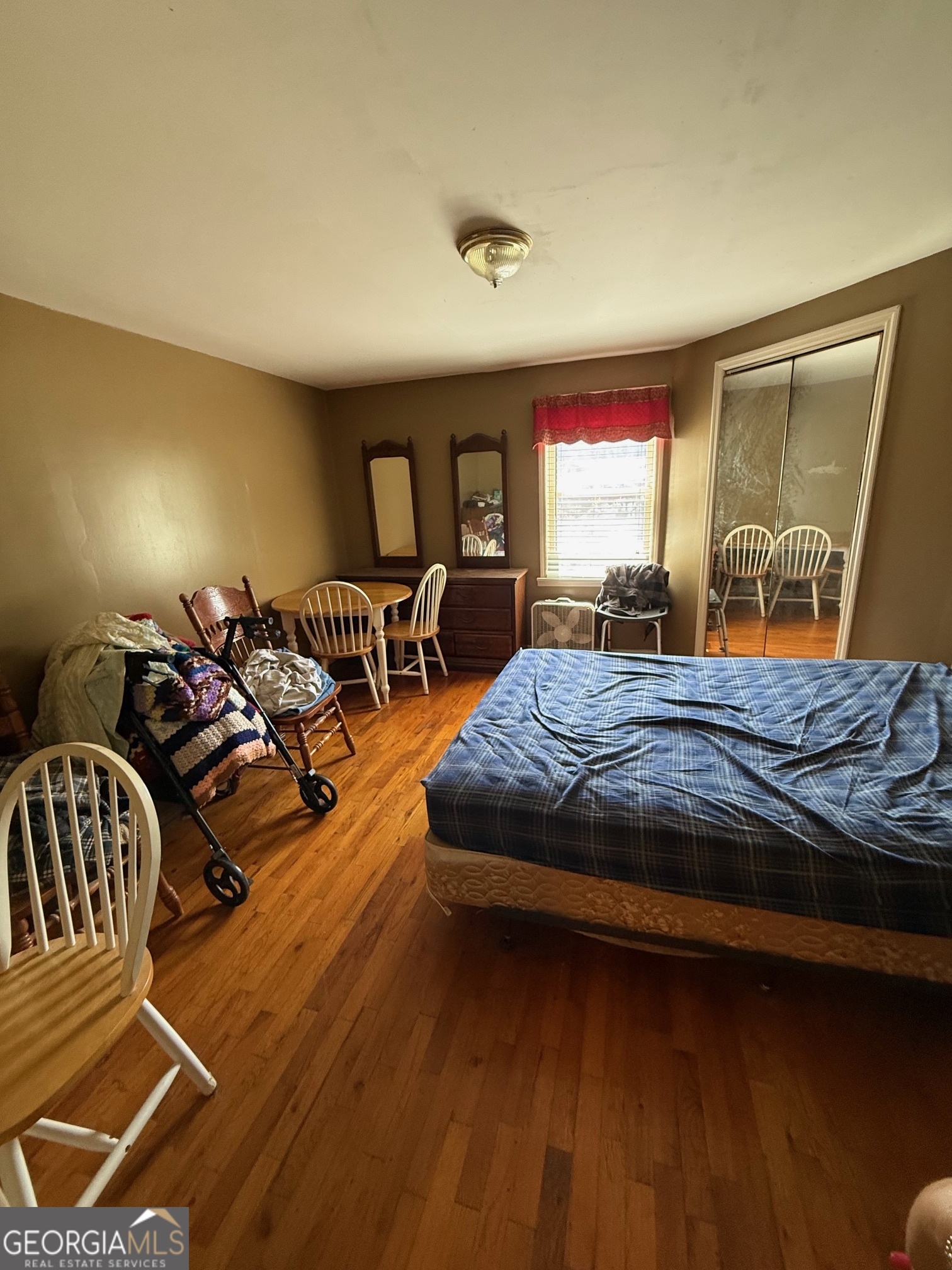 1600 Grant Avenue Manchester, GA 31816 - Photo 14 of 37 a bedroom with a bed and wooden floor