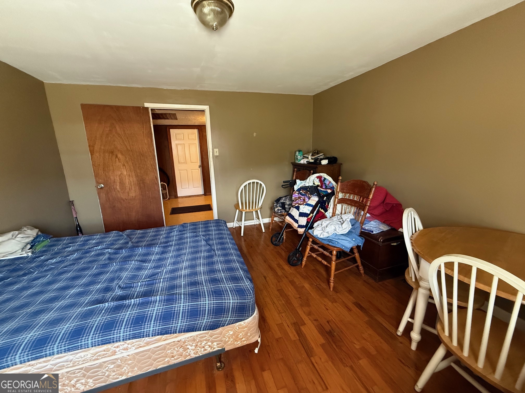 1600 Grant Avenue Manchester, GA 31816 - Photo 15 of 37 a bedroom with a bed and wooden floor