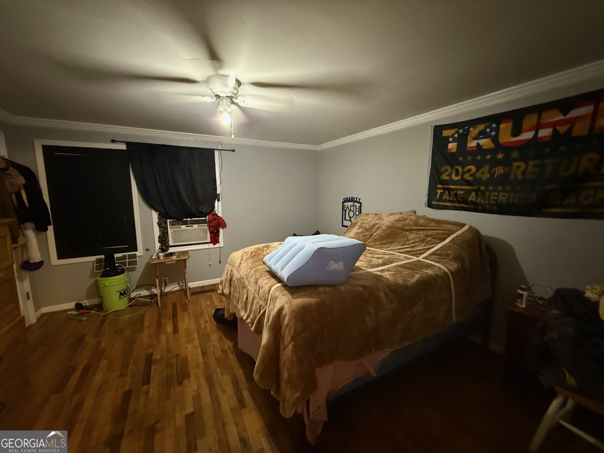 1600 Grant Avenue Manchester, GA 31816 - Photo 19 of 37 a bed sitting in a bedroom next to a window