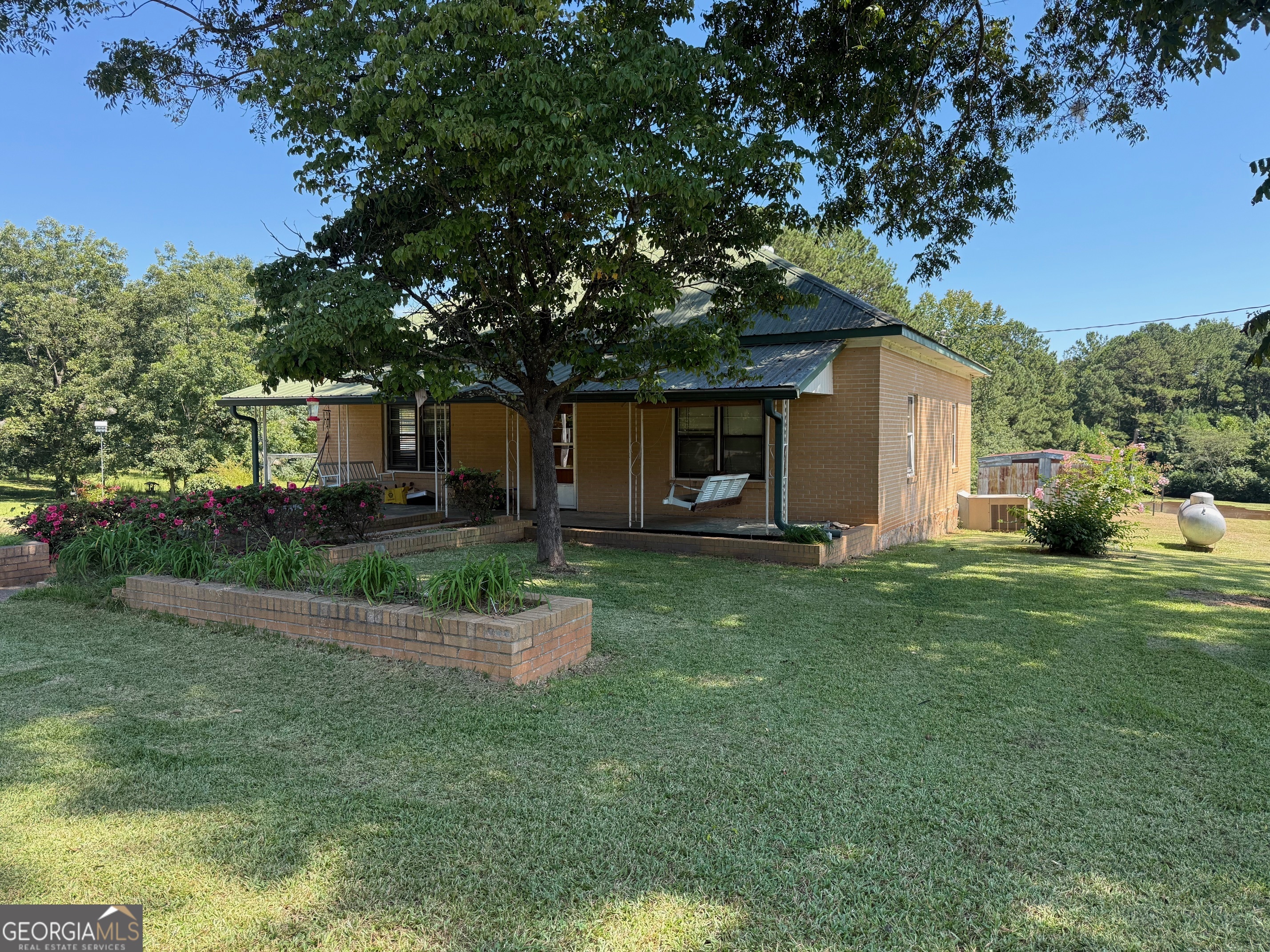 1600 Grant Avenue Manchester, GA 31816 - Photo 28 of 37 a front view of a house with a garden