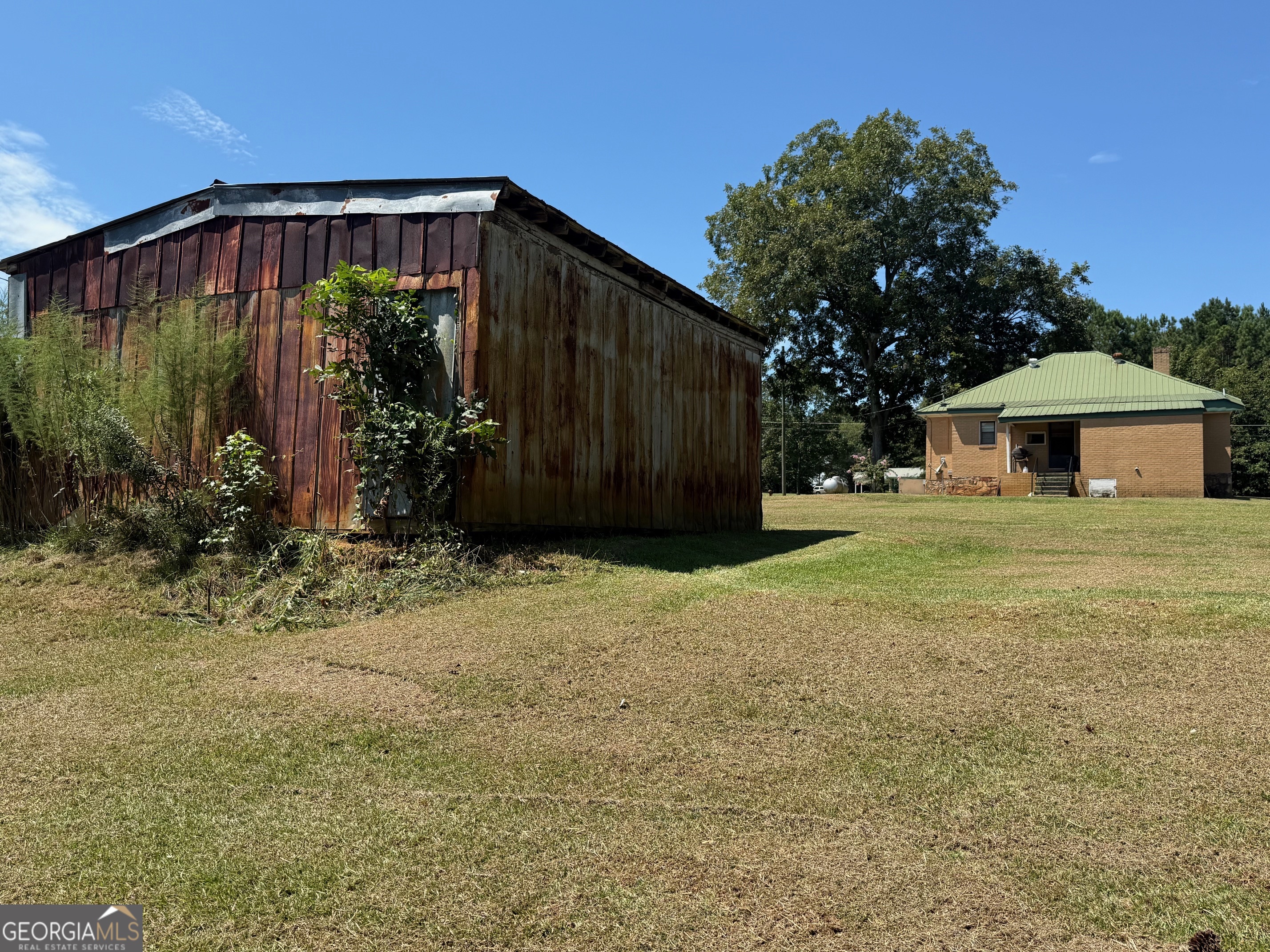 1600 Grant Avenue Manchester, GA 31816 - Photo 32 of 37 a front view of a house with garden