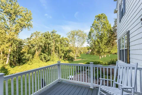 a view of a balcony with wooden fence