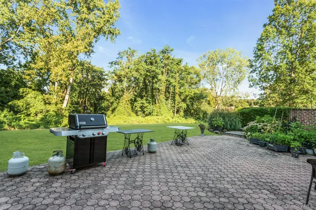a view of a backyard with chairs