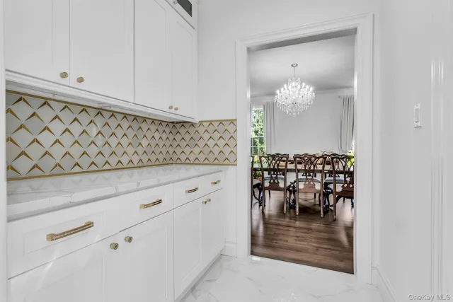 a view of living room and chandelier