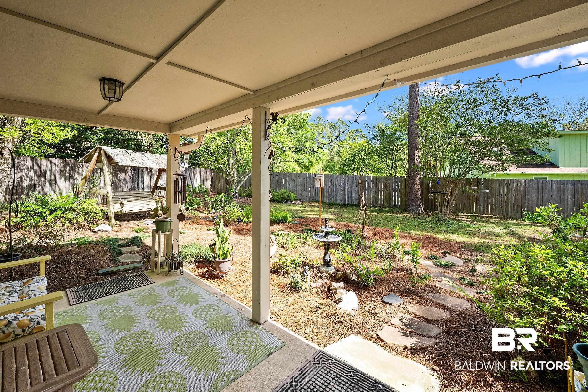 4026 Kingsrow Row Mobile, AL 36619 - Photo 3 of 51 Fenced backyard with a patio area