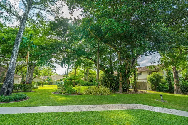 a view of a chairs and table in patio