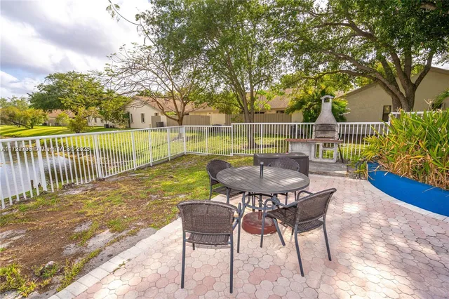 a view of a house with backyard porch and furniture