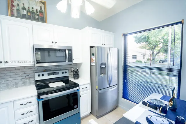 a room with furniture and view of living room