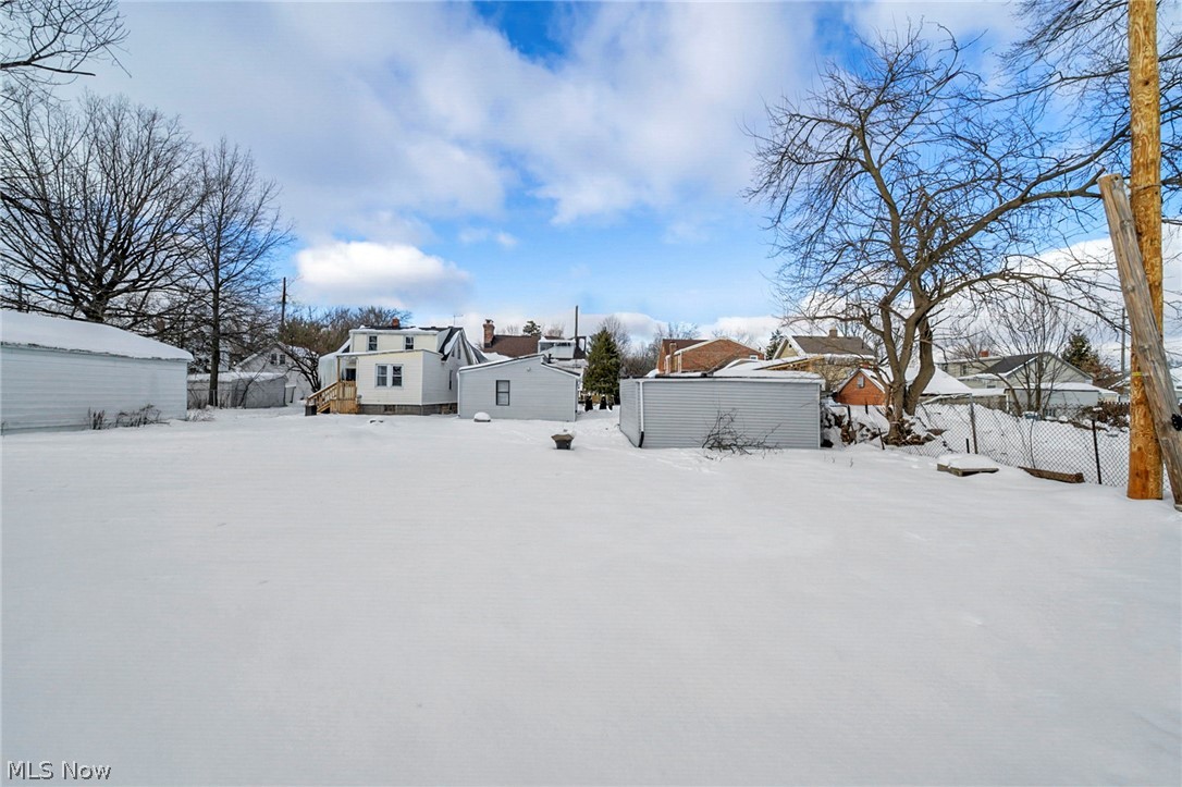 4717 Snow Road Cleveland, OH 44134 - Photo 23 of 30 Snowy yard featuring a residential view and an outbuilding