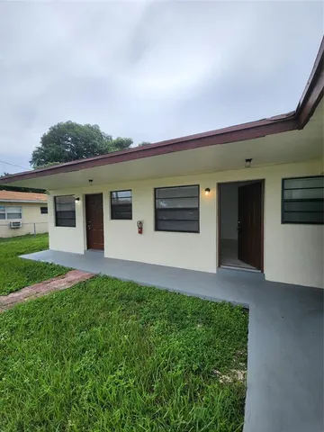 a view of a hallway to rooms
