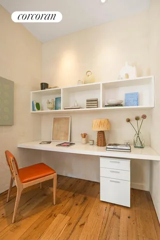 a view of a kitchen with a sink and cabinets