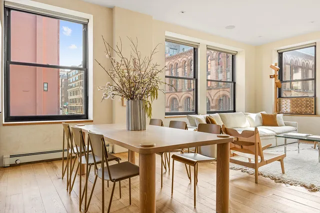 a view of a kitchen with a sink and cabinets