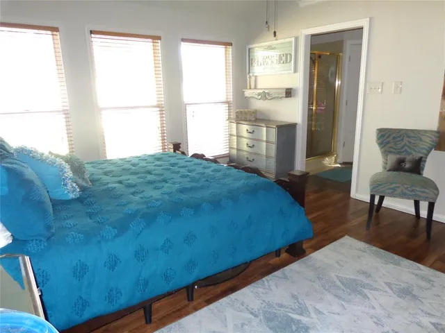 a bed room with furniture and a window