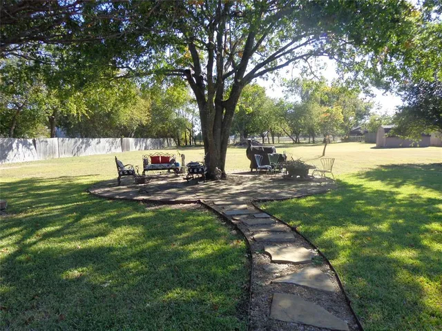a dining room with table and chairs