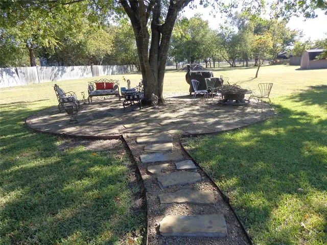 a view of swimming pool with a yard