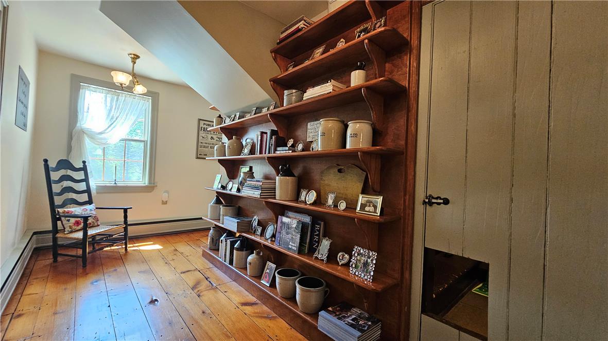 585 Buttermilk Road Hellertown, PA 18055 - Photo 29 of 82 Hearty wood flooring and built-in shelving complement a cozy reading nook.